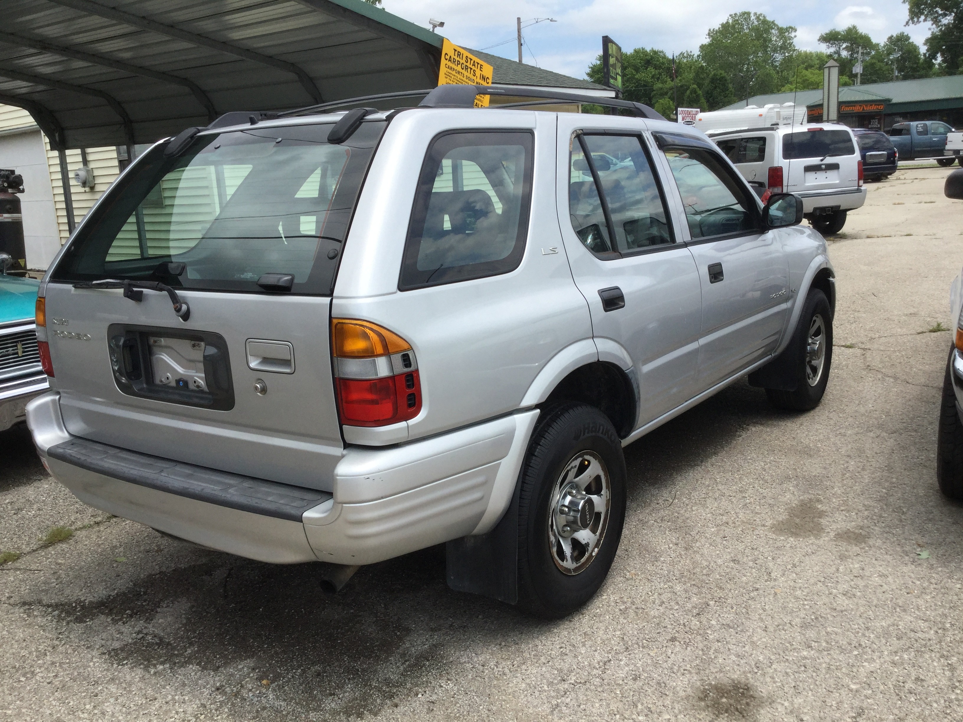 Silver, grey cloth interior, V-6, auto, 4 door, am/fm, power locks ...
